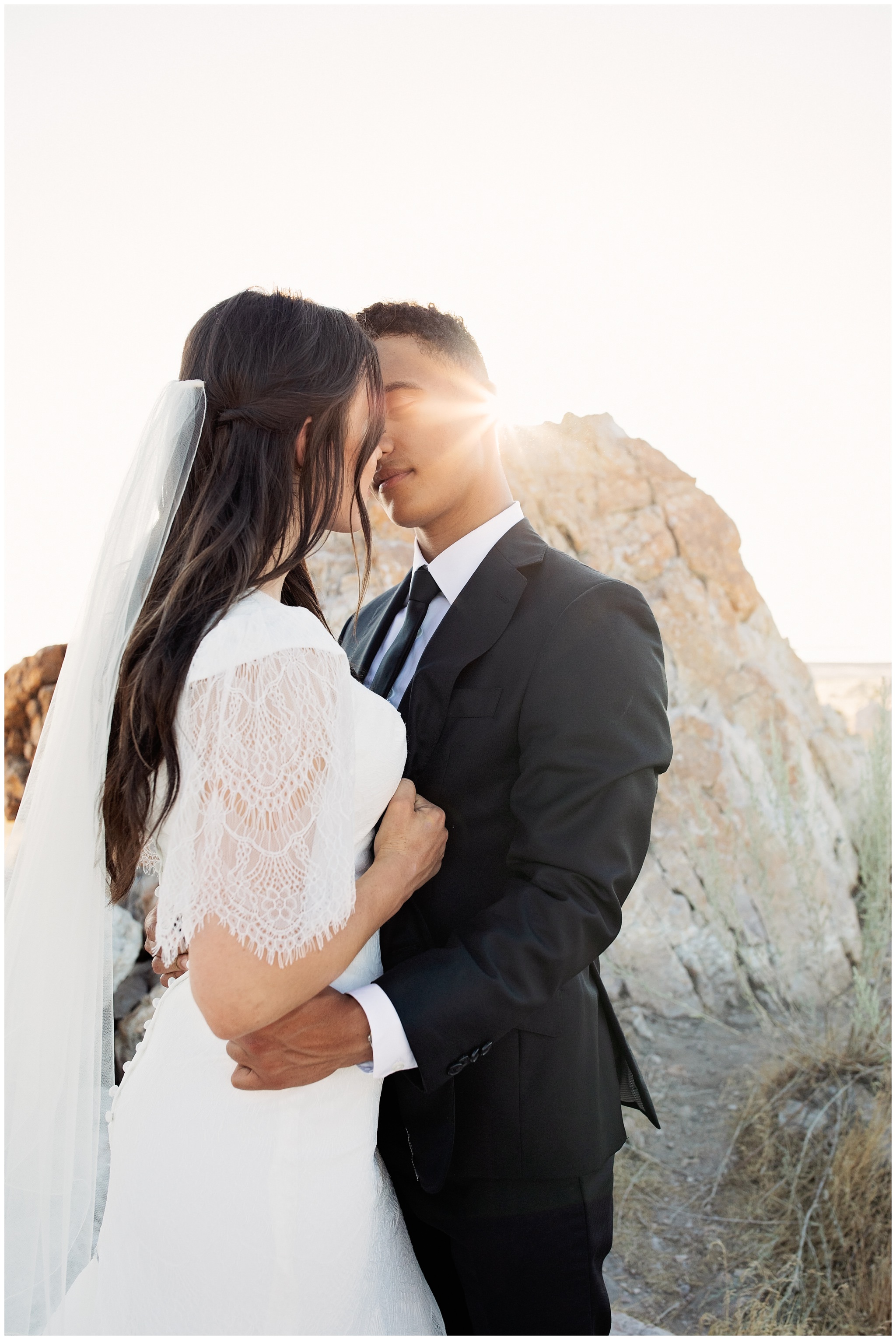 Sunset with the Bride and Groom about to kiss at Antelope island, Ladyfinger point, Utah