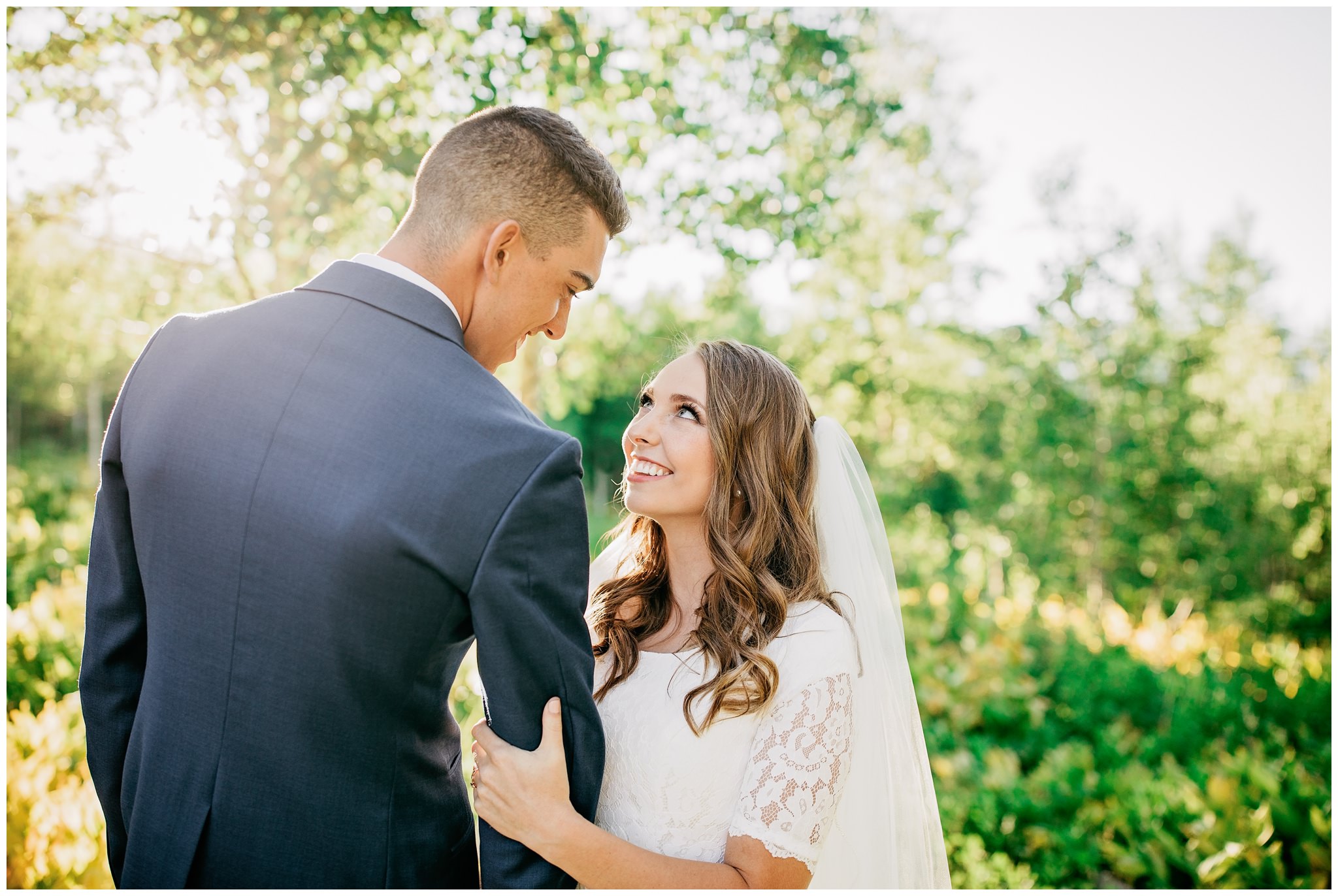 Bride and groom in mountains near aspen tree for their bridals