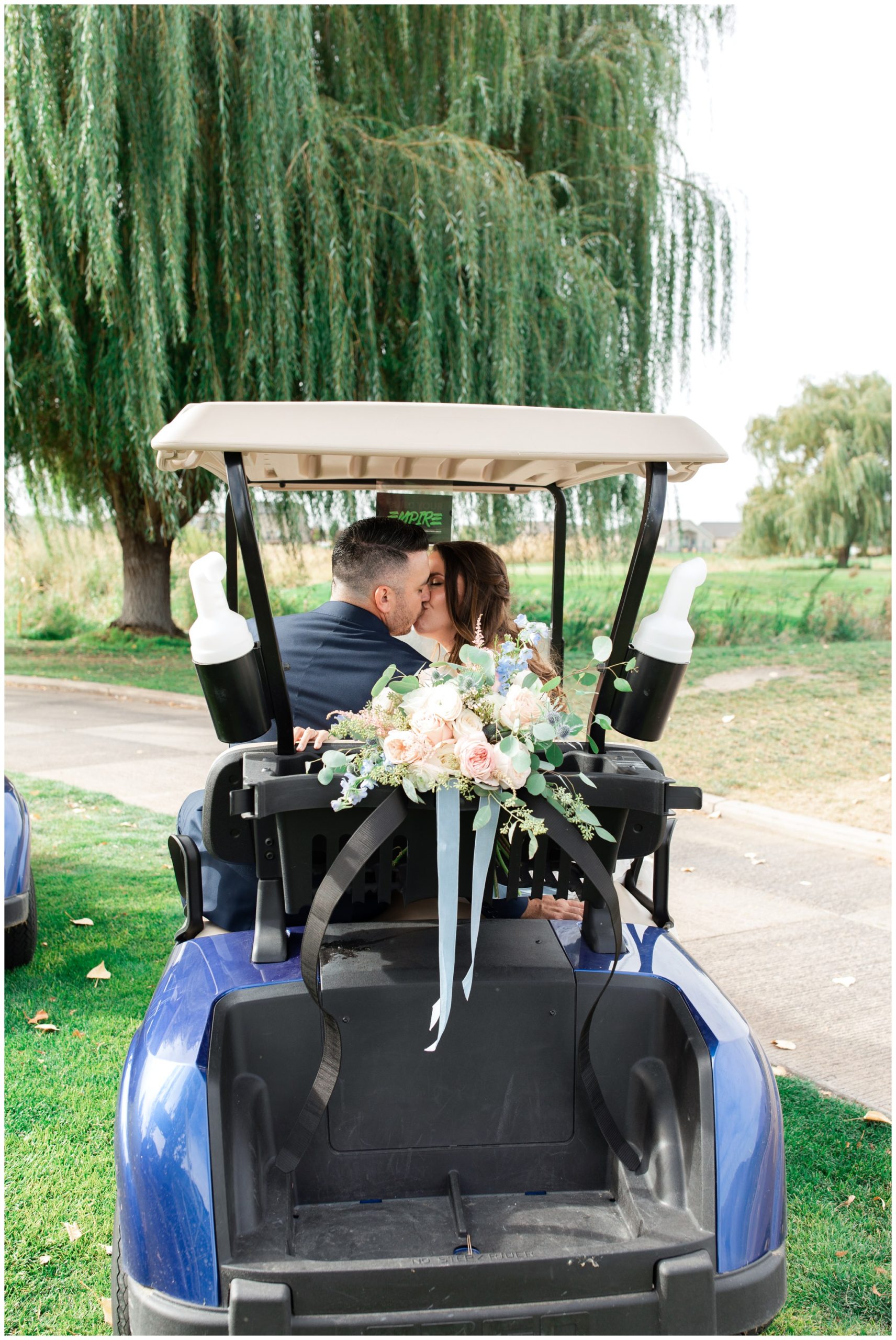 Bride and groom riding in golf cart at the Link of Sleepy Ridge 