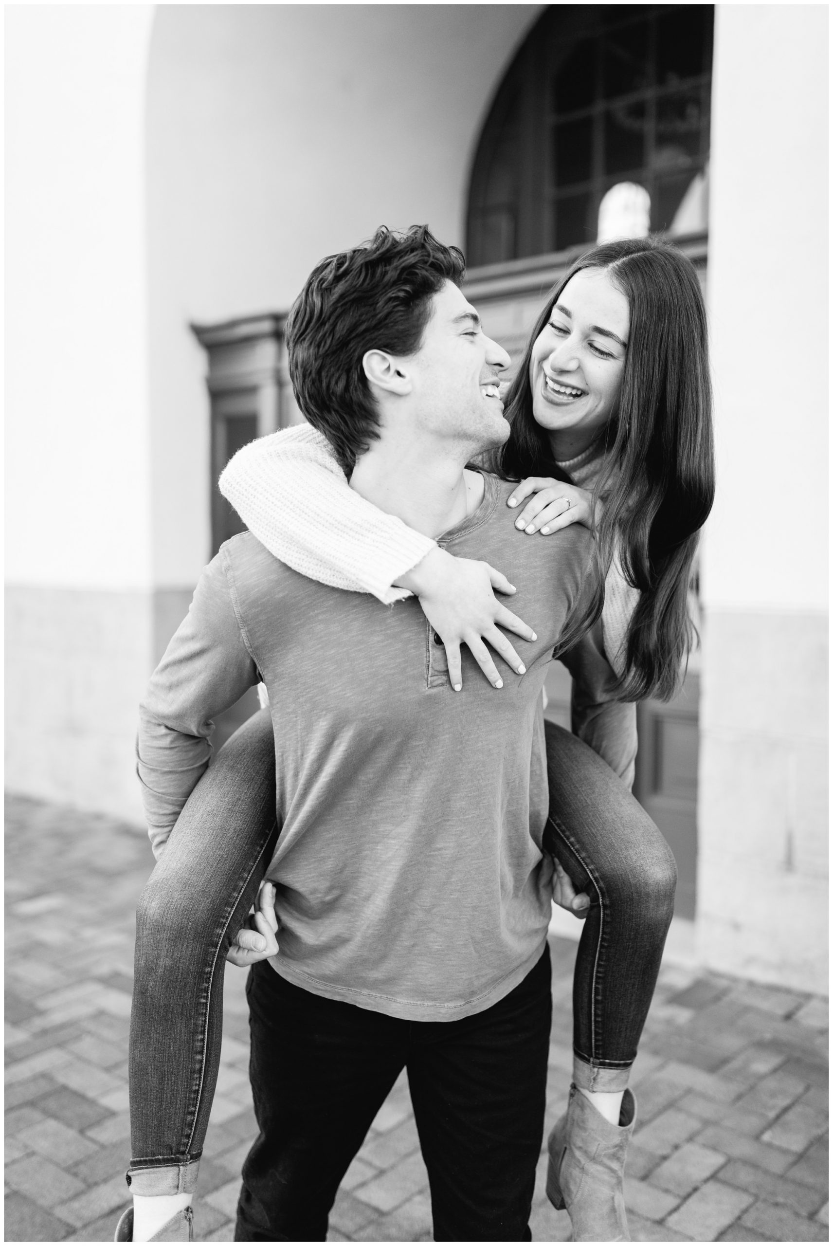 Piggy back ride pose of couple for their engagement photos