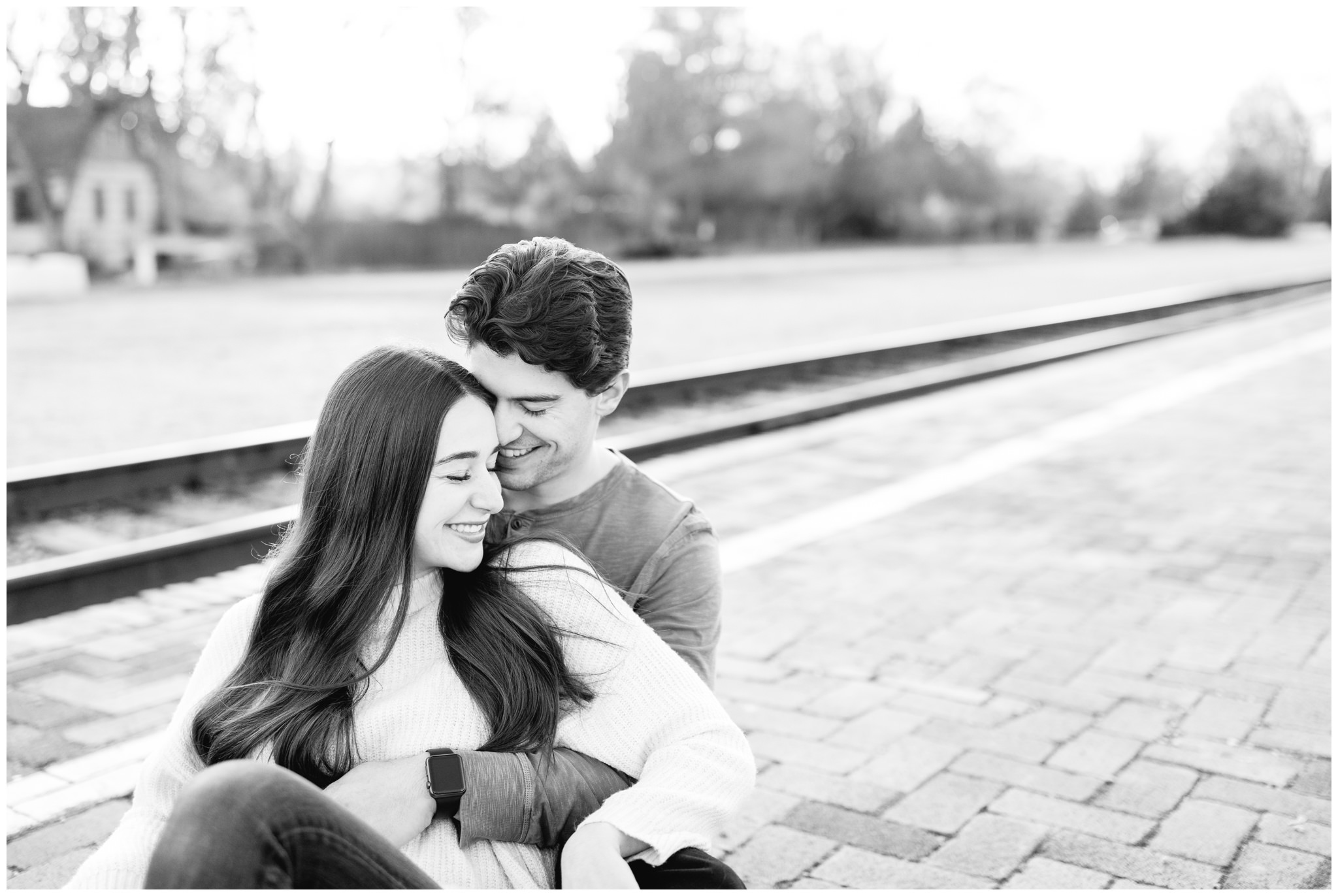 Black and white image of couple at the Boise Train depot for Winter Engagements