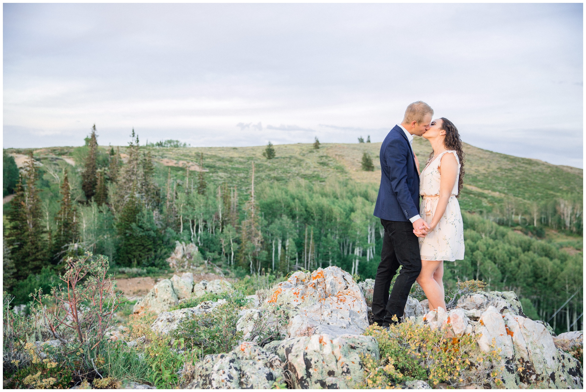 Couple kissing on mountain top in Park City Utah