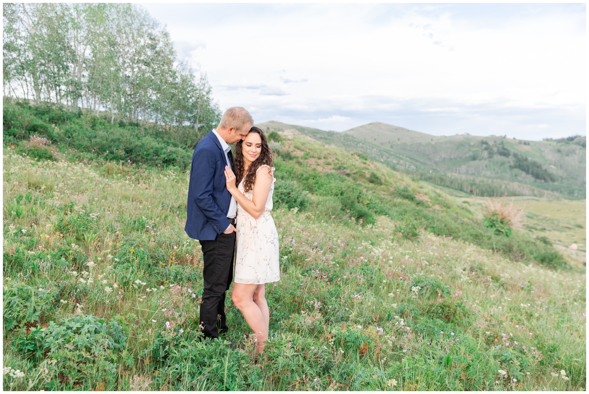 Wildflowers in Park City Utah with a couple posing for Engagement photos
