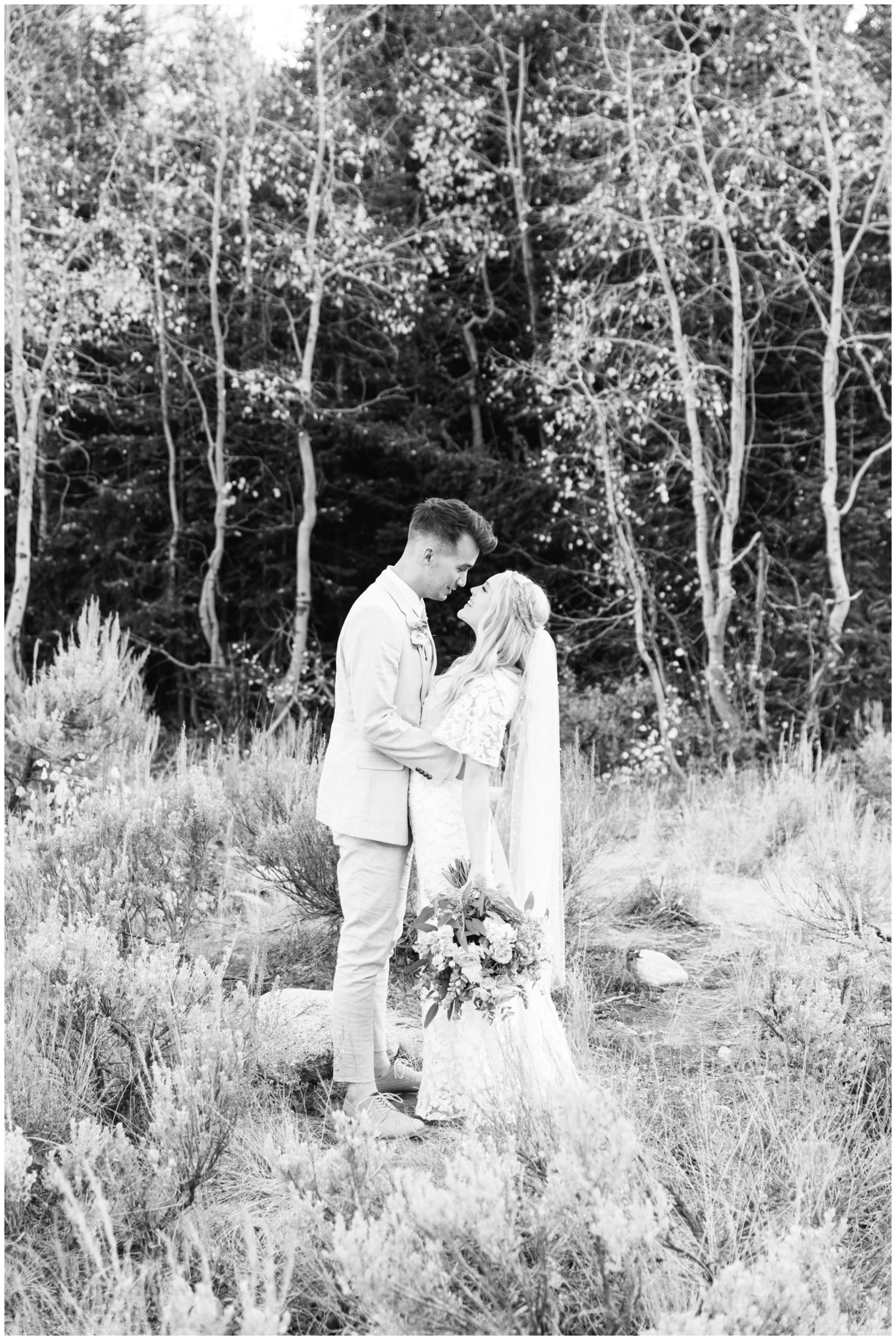 Bride and groom smiling at each other