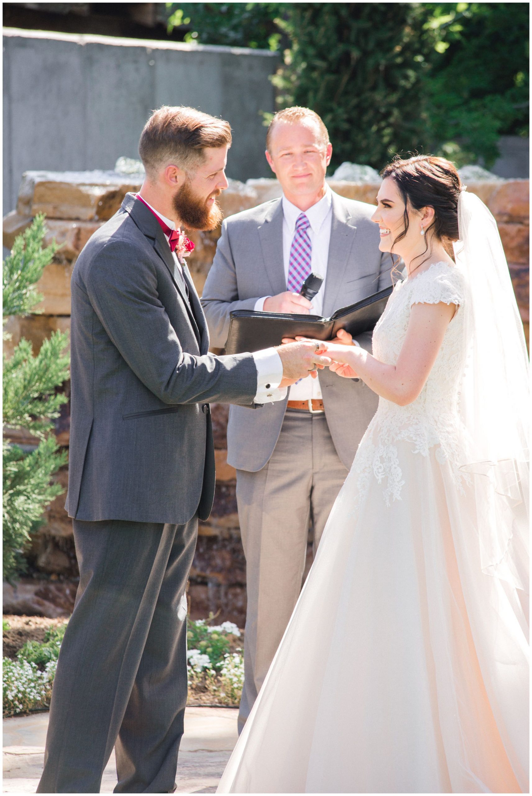 Bride and groom exchanging vows in Lindon utah at the Wild oak venue