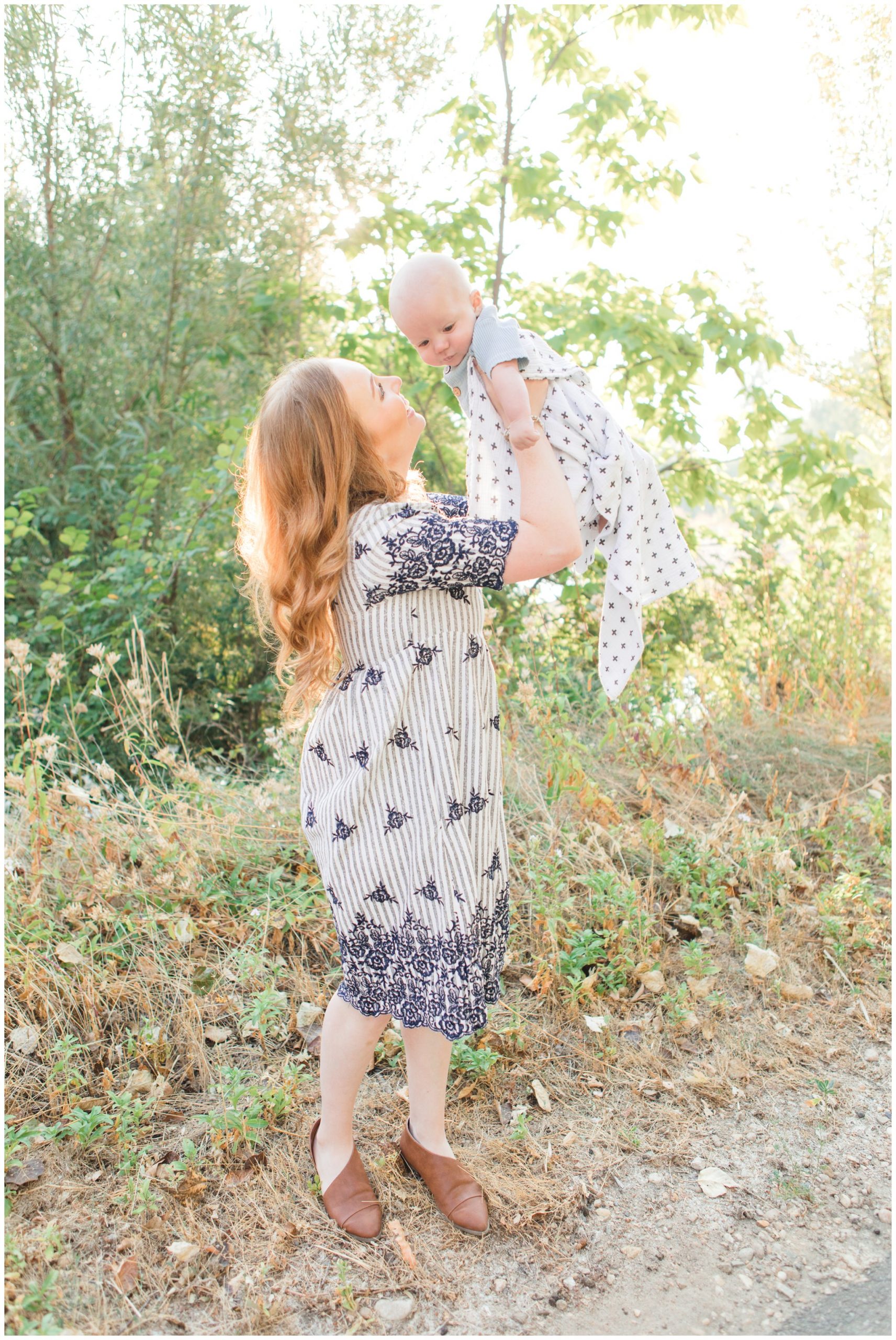 Mom holding baby in fields of lubbock texas