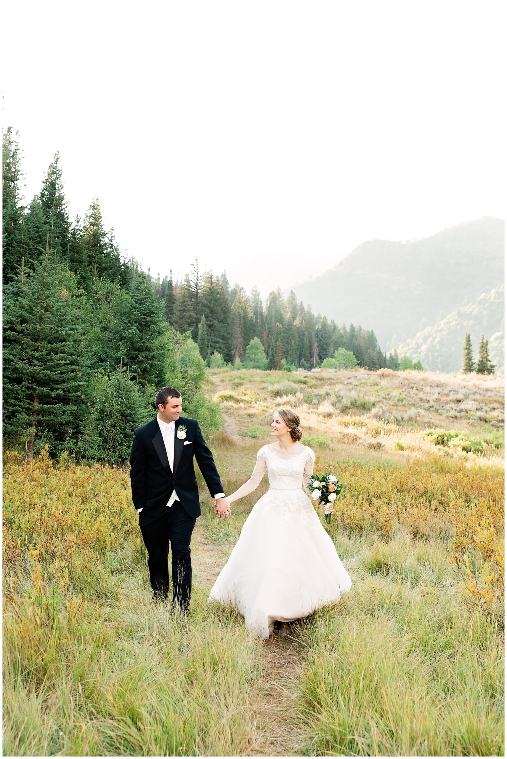 Bride and groom walking along mountain trail at Jordan Pines Campground