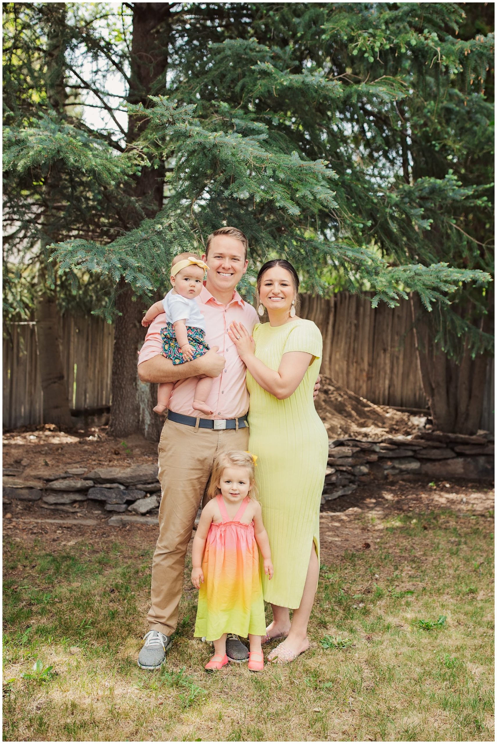 Family smiling for the camera in their backyard 