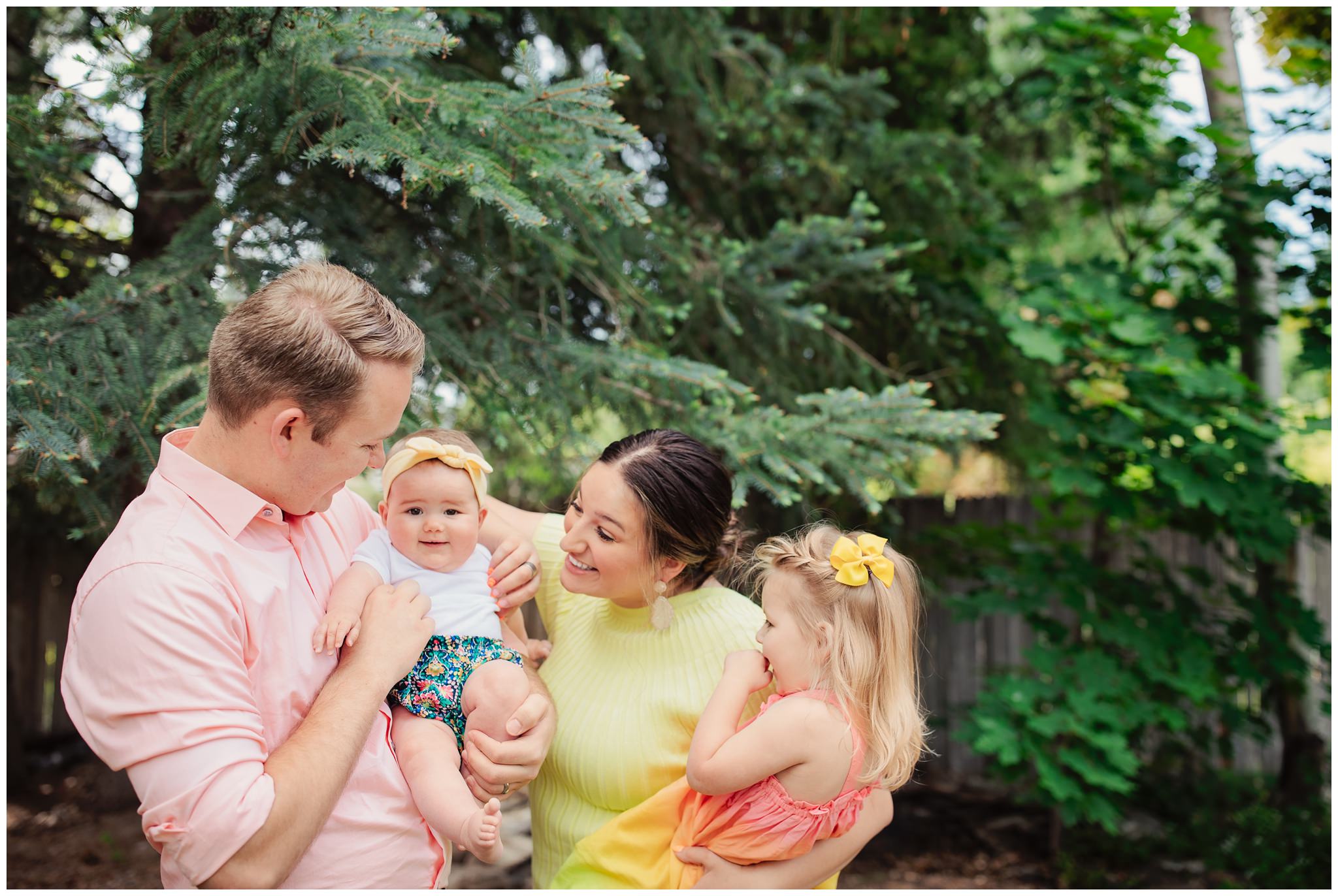 Family laughing together during their backyard family session