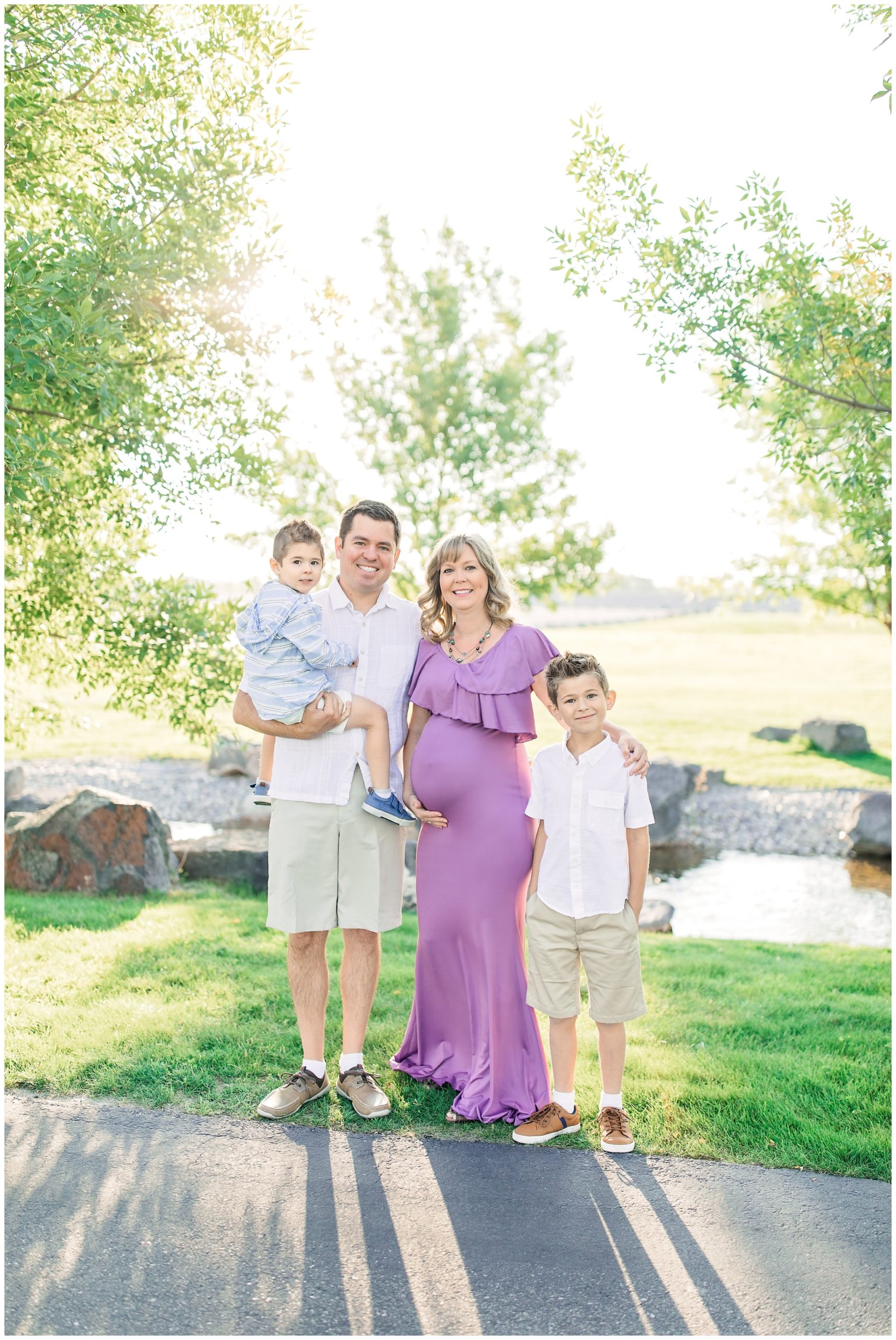 Family posing by stream in Lubbock Texas