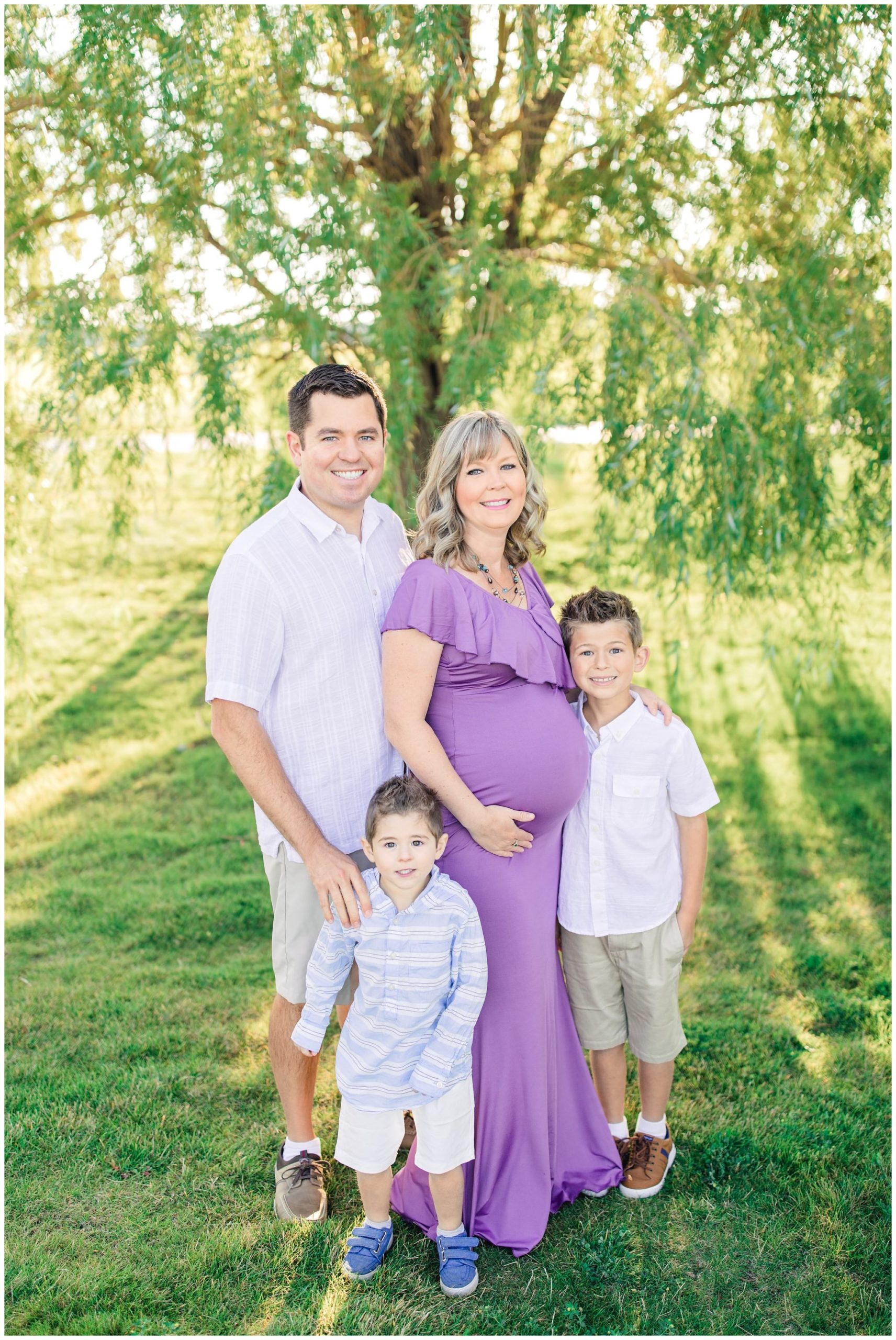 Family standing by willow tree in Lubbock Texas