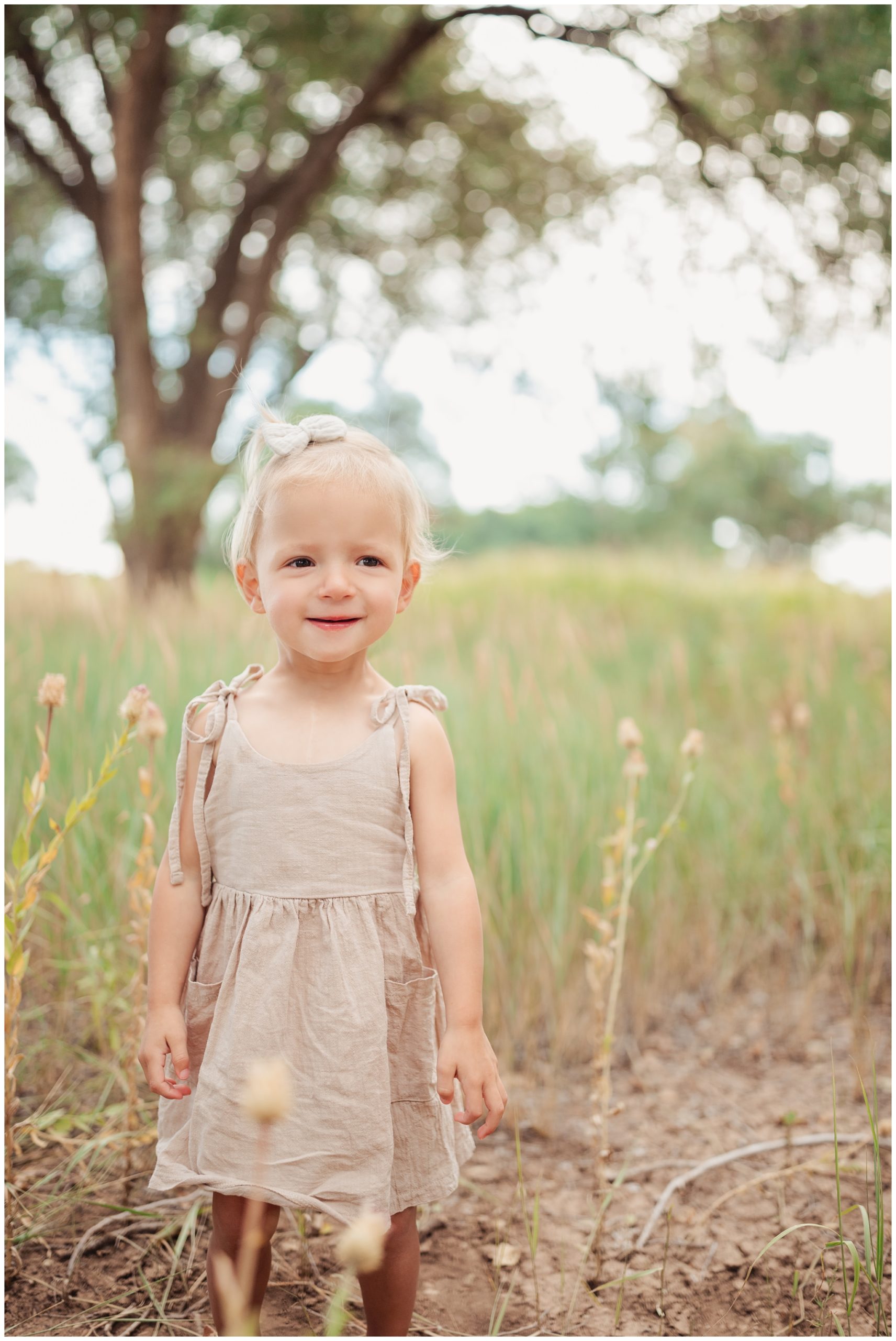 Toddler girl smiling for camera at Lubbock Lake National historic landmark