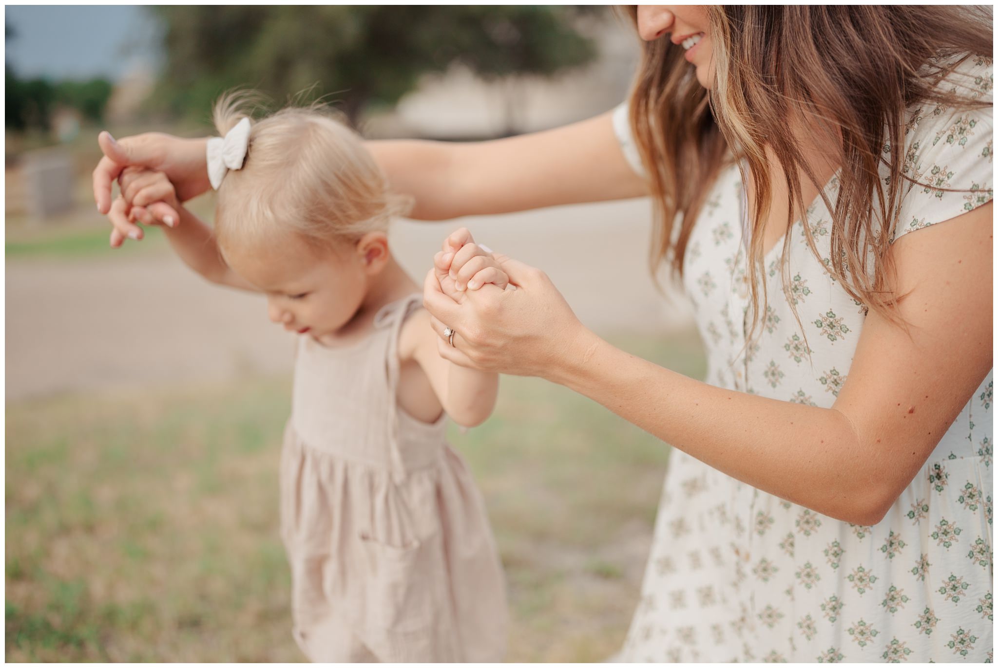 Mom helping daughter walk at Lubbock Lake historic Landmark