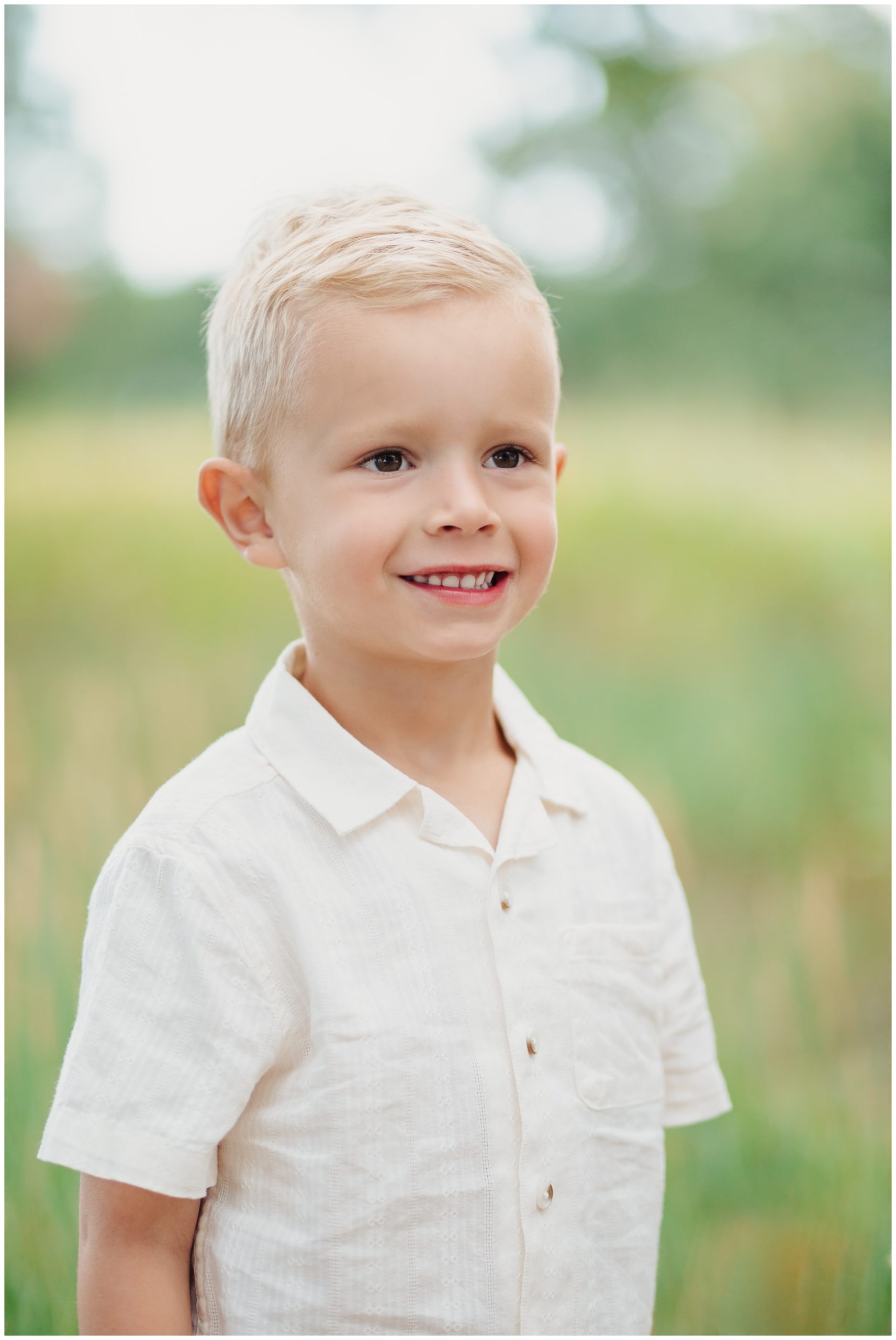 Toddler boy smiling for pictures in Lubbock Texas