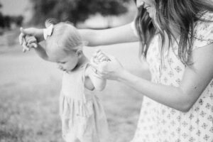 Mom and daughter walking together at the Lubbock historic landmark